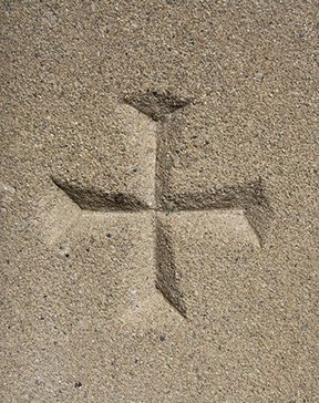 Cross in sand