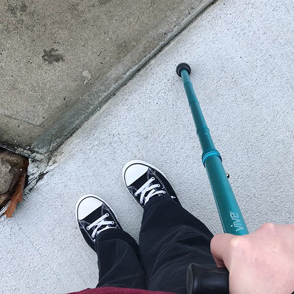 Sneakers and cane