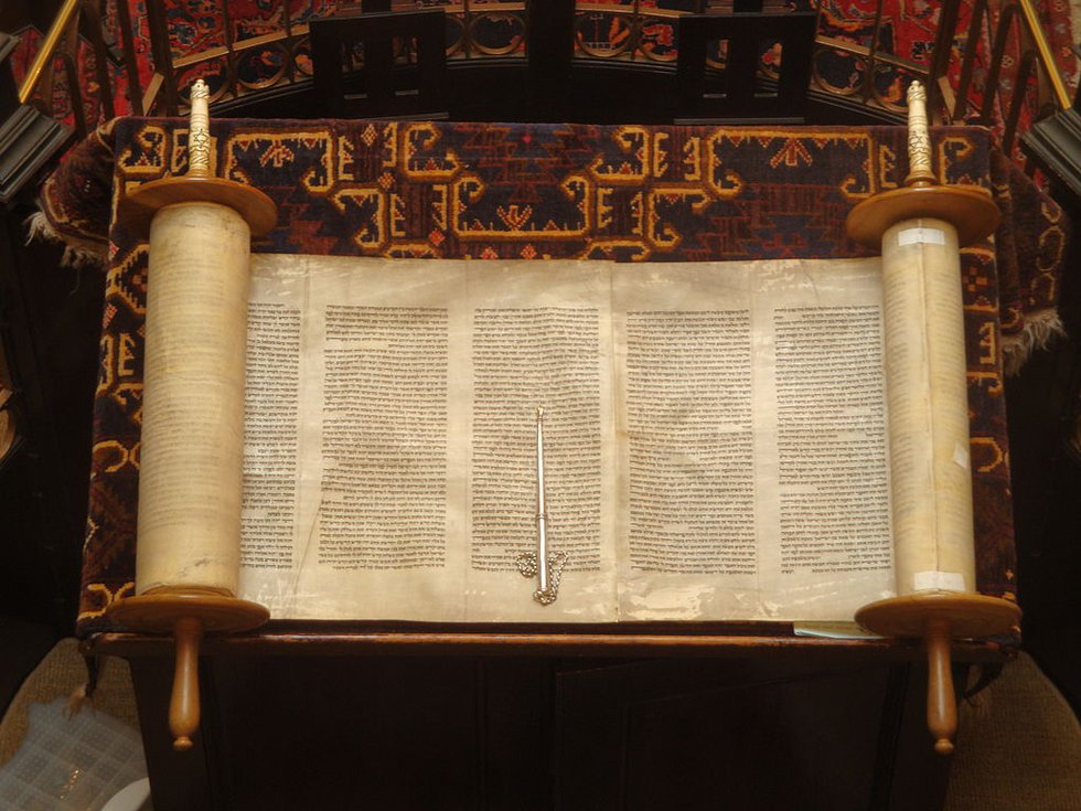A Torah scroll and pointer used to read scripture.