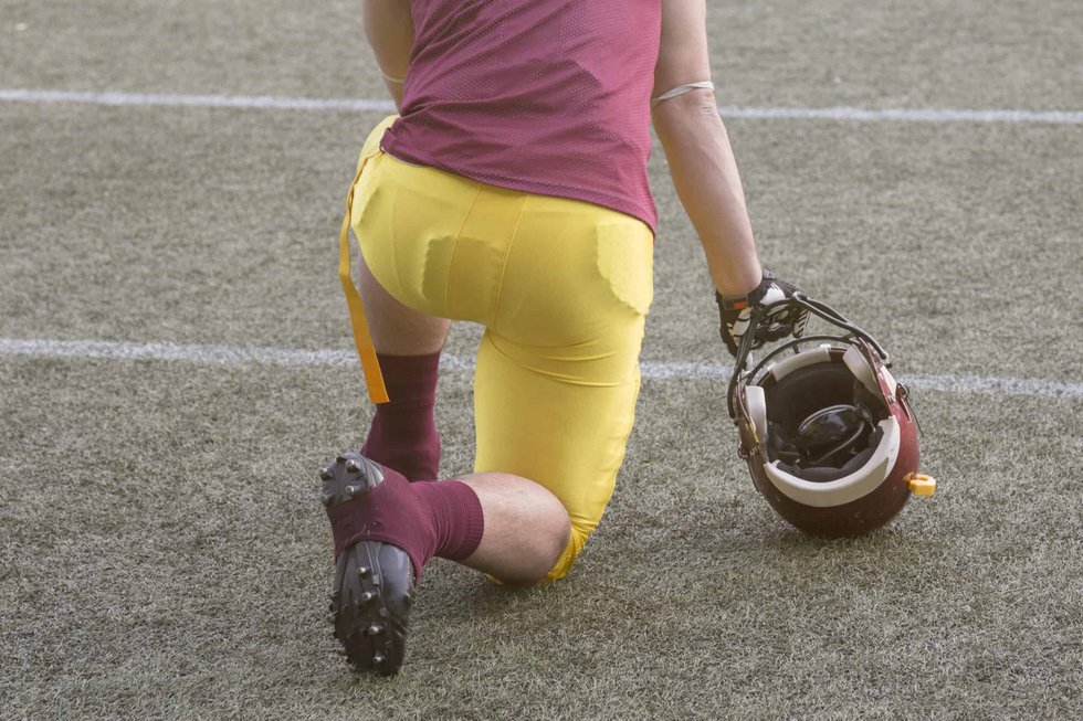 Kneeling football player